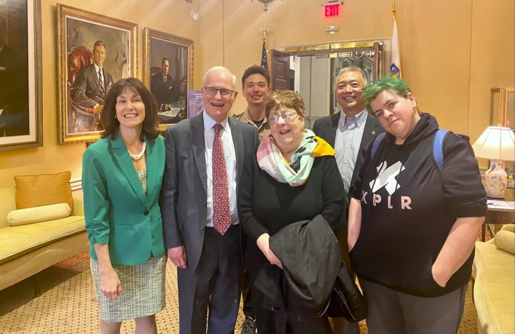 Senator Barrett with the family of Hank Manz