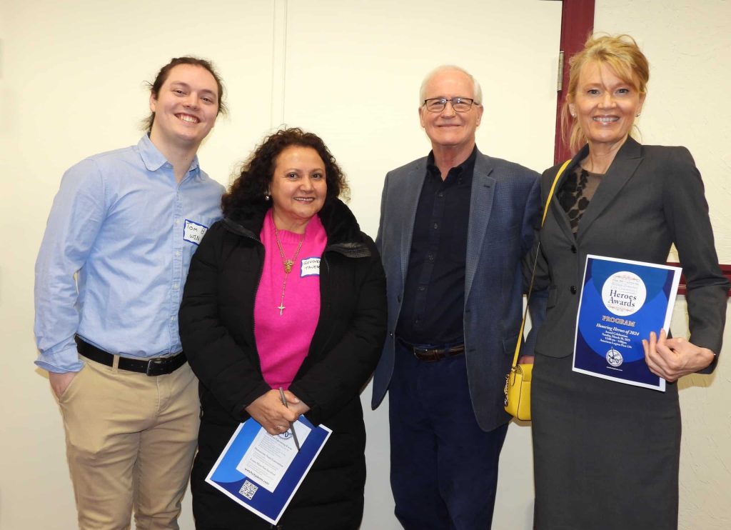 Senator Barrett stands with Tom Benavides, Genoveva Tavera, and Mara Dolan