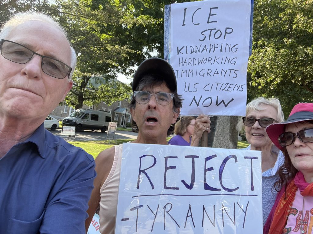 Senator Barrett takes a selfie with protestors in Concord center. 