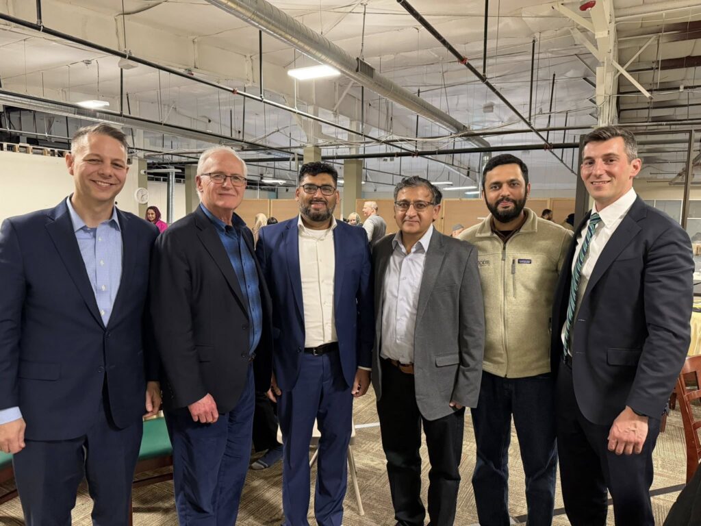 Senator Barrett stands with Rep. Simon Cataldo, Rep. Jim Arciero, and members of ISGL.